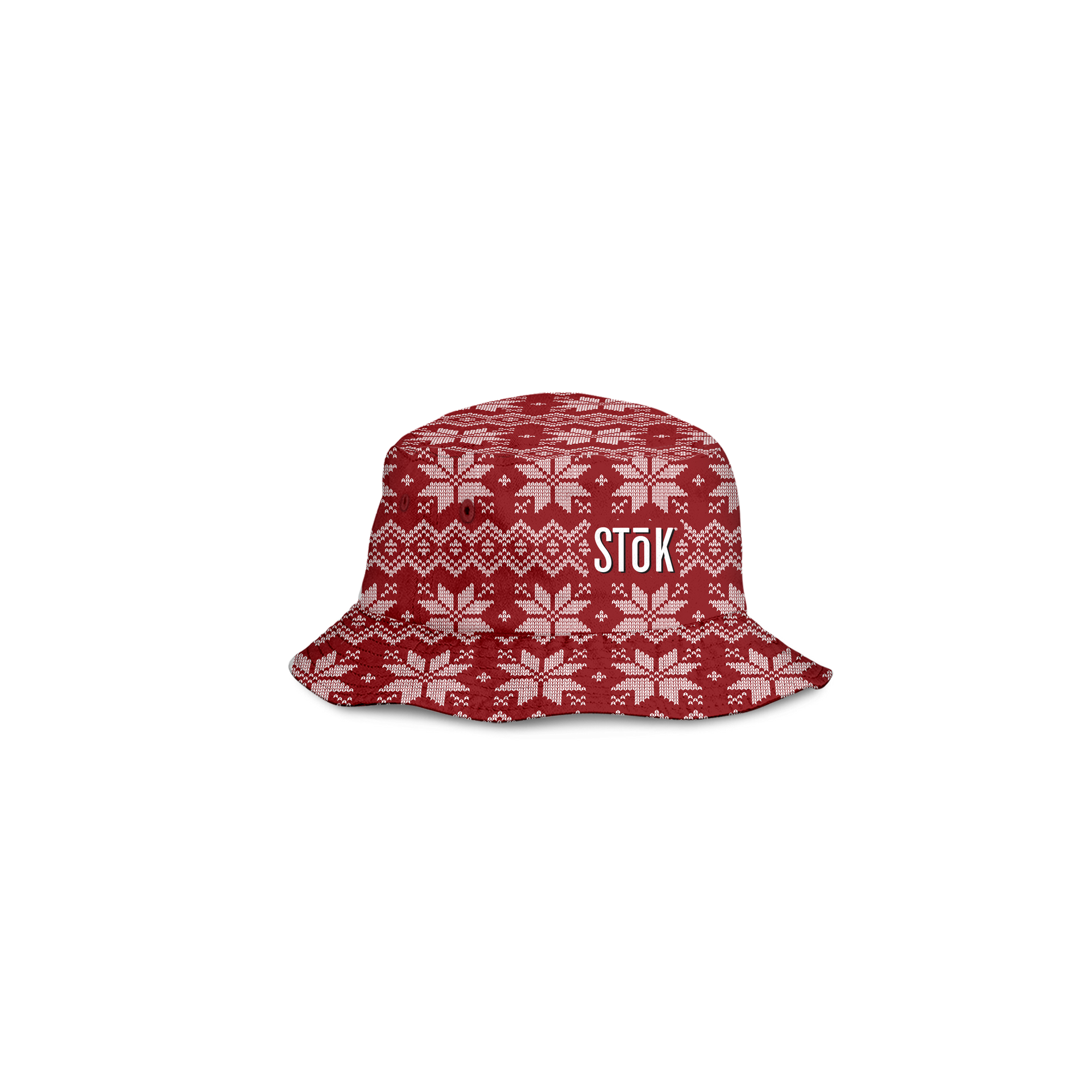 The alternate reversible inside of the red bucket hat flipped out with a festive, knitted pattern design featuring white snowflakes and geometric shapes throughout. The Stōk logo is displayed in white on the front of the hat, maintaining a clean and simple contrast against the intricate design.