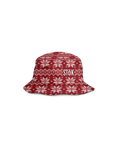 The alternate reversible inside of the red bucket hat flipped out with a festive, knitted pattern design featuring white snowflakes and geometric shapes throughout. The Stōk logo is displayed in white on the front of the hat, maintaining a clean and simple contrast against the intricate design.